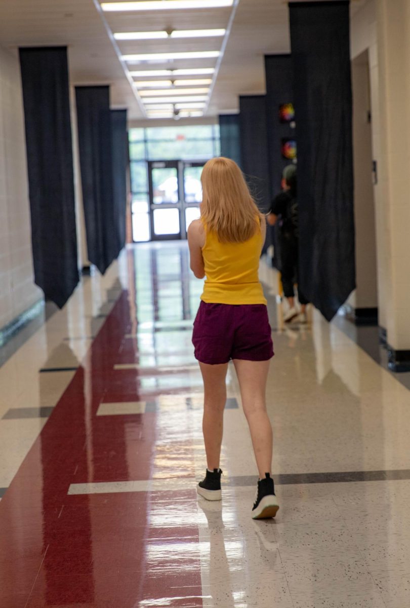 Lorelei Wise (10) walks to the end of one of the treasure hunt locations to prepare for the seniors. 