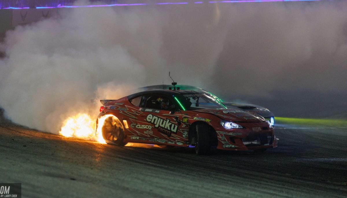 Hiroya Minowa catches fire after leading James Deane (Provided by Formula Drift).