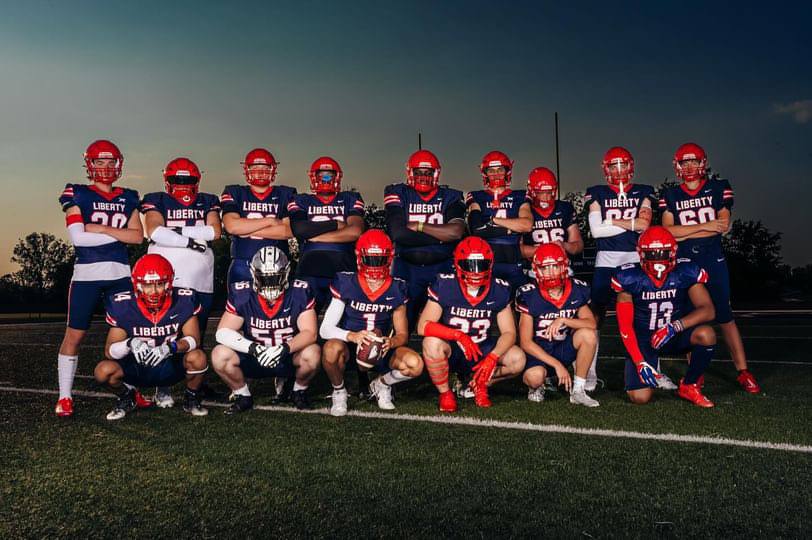 Football seniors pose for a picture together for their annual media day for the last time for before game on Friday, Aug. 30.