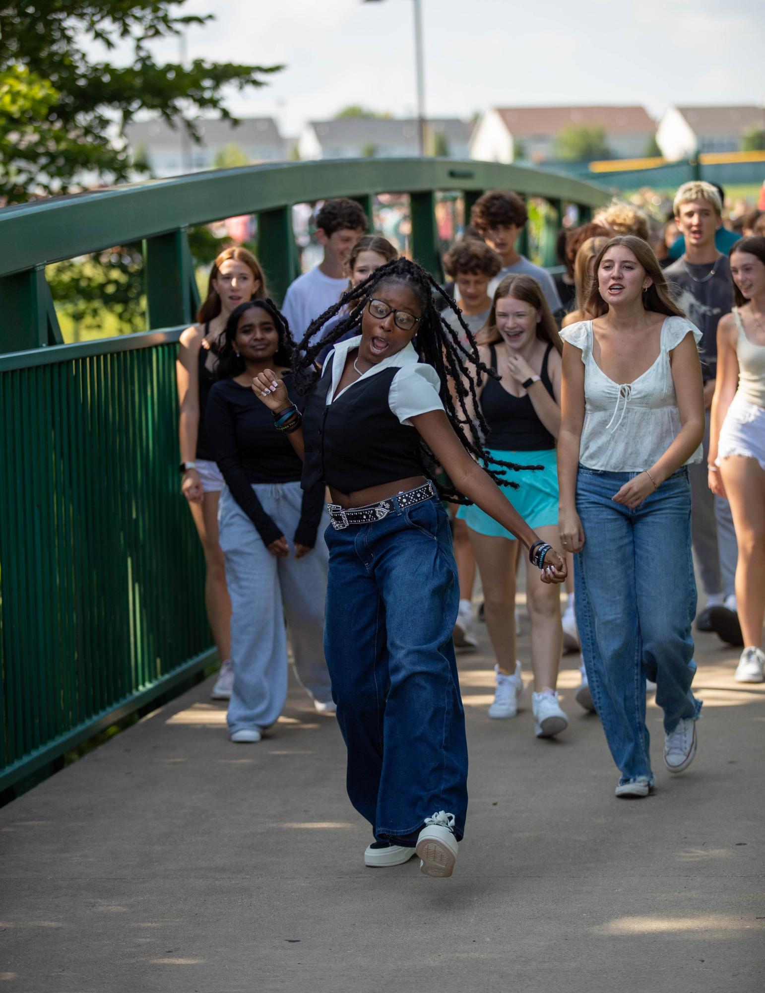 Kendal Ellis dances across the bridgewalk on her first day of school. "I just felt super ecstatic and I thought I only walk the bridge once so I wanted to make it memorable," Ellis said. 