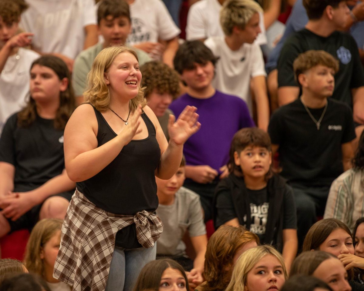 Abigail Wagner claps at the first assembly of the school year.