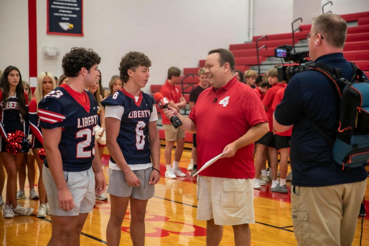 Football players Jack Ryan (12) and Caiden Galati (11) are interviewed by KMOV reporter Matt Chambers during the Back to School Tour.