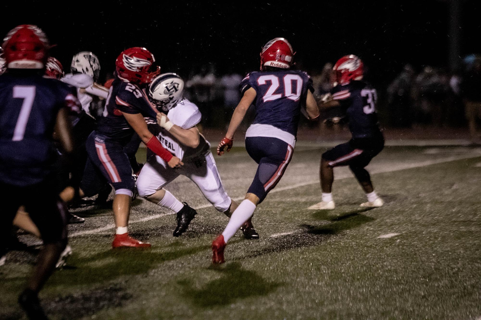 Matthew Mauck (12) runs to defend a player from Francis Howell Central during the game on Friday, Aug. 30.