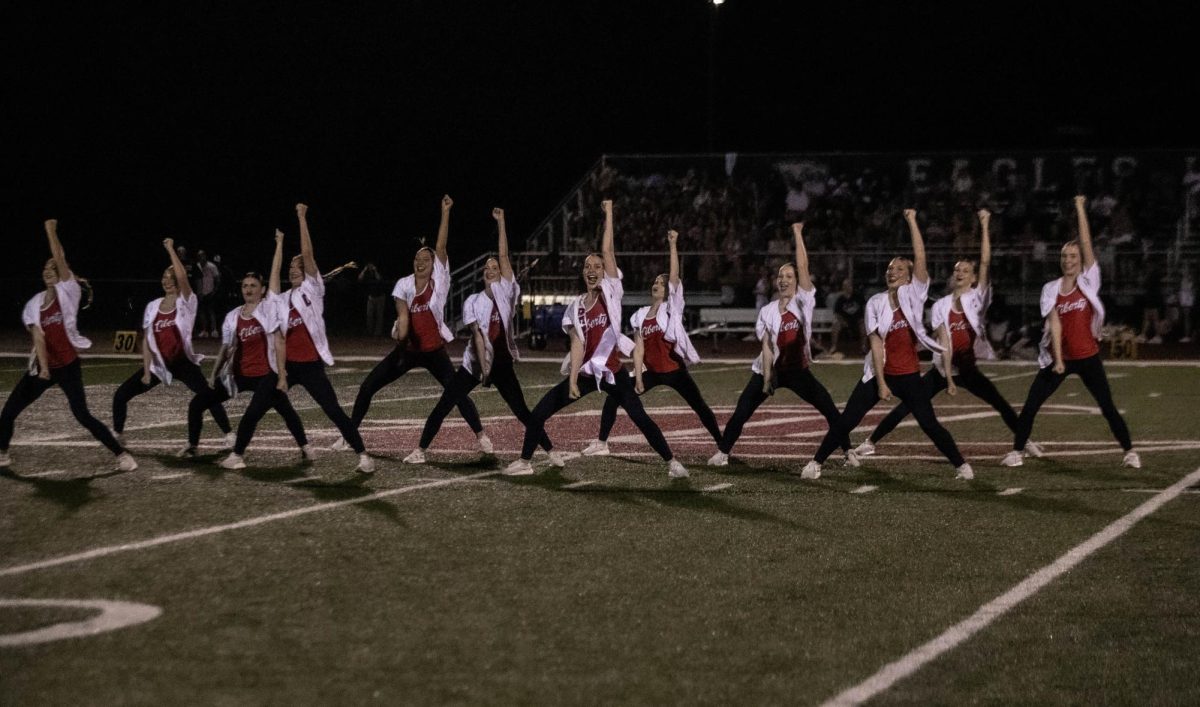 The dance team performs during half time at senior night football game.