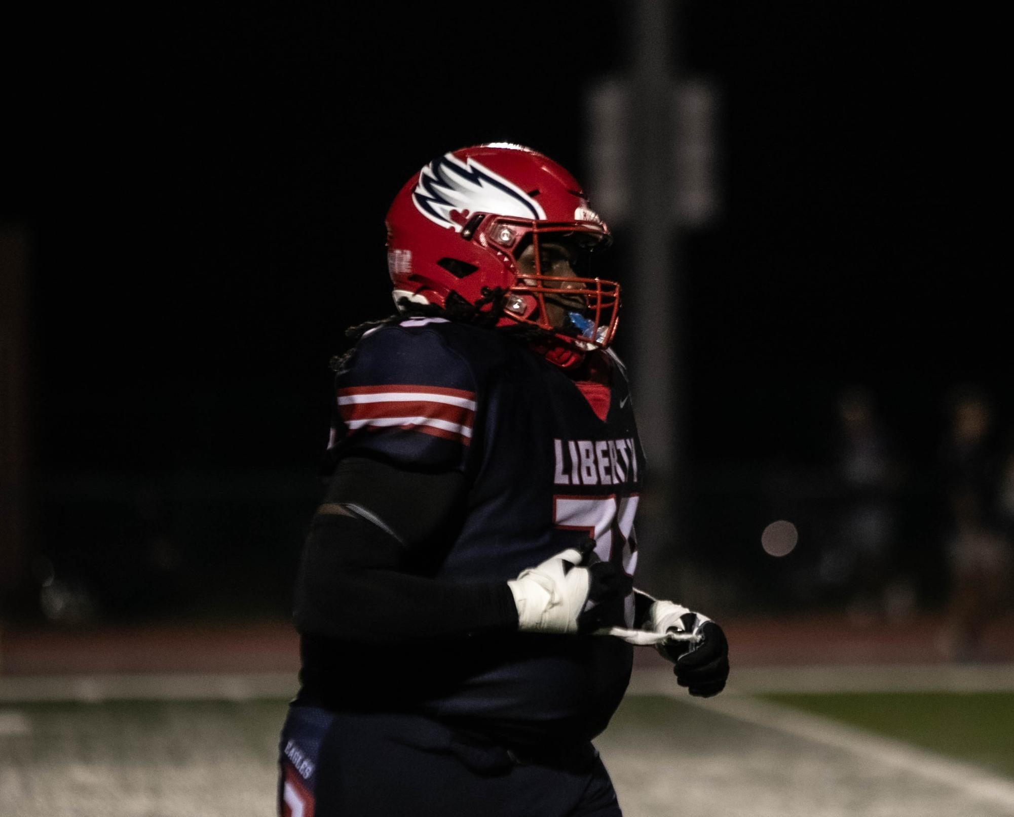 Kaileb Rhen (Big K) (12) runs off the field after playing the Friday night game against Francis Howell Central on Aug. 30.