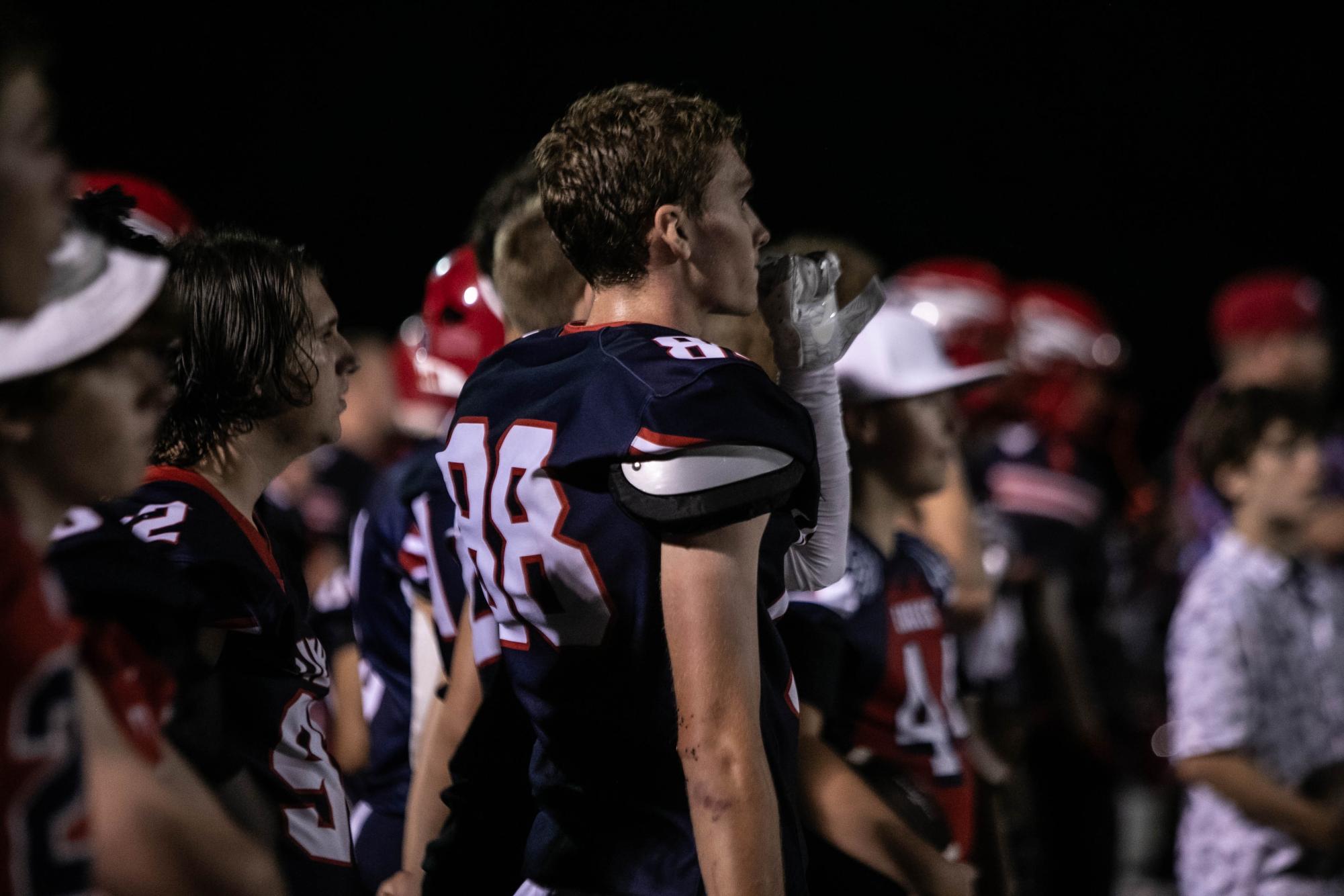 Trent Fisher (12) watches intently towards the field during the game on Friday, Aug. 30. 