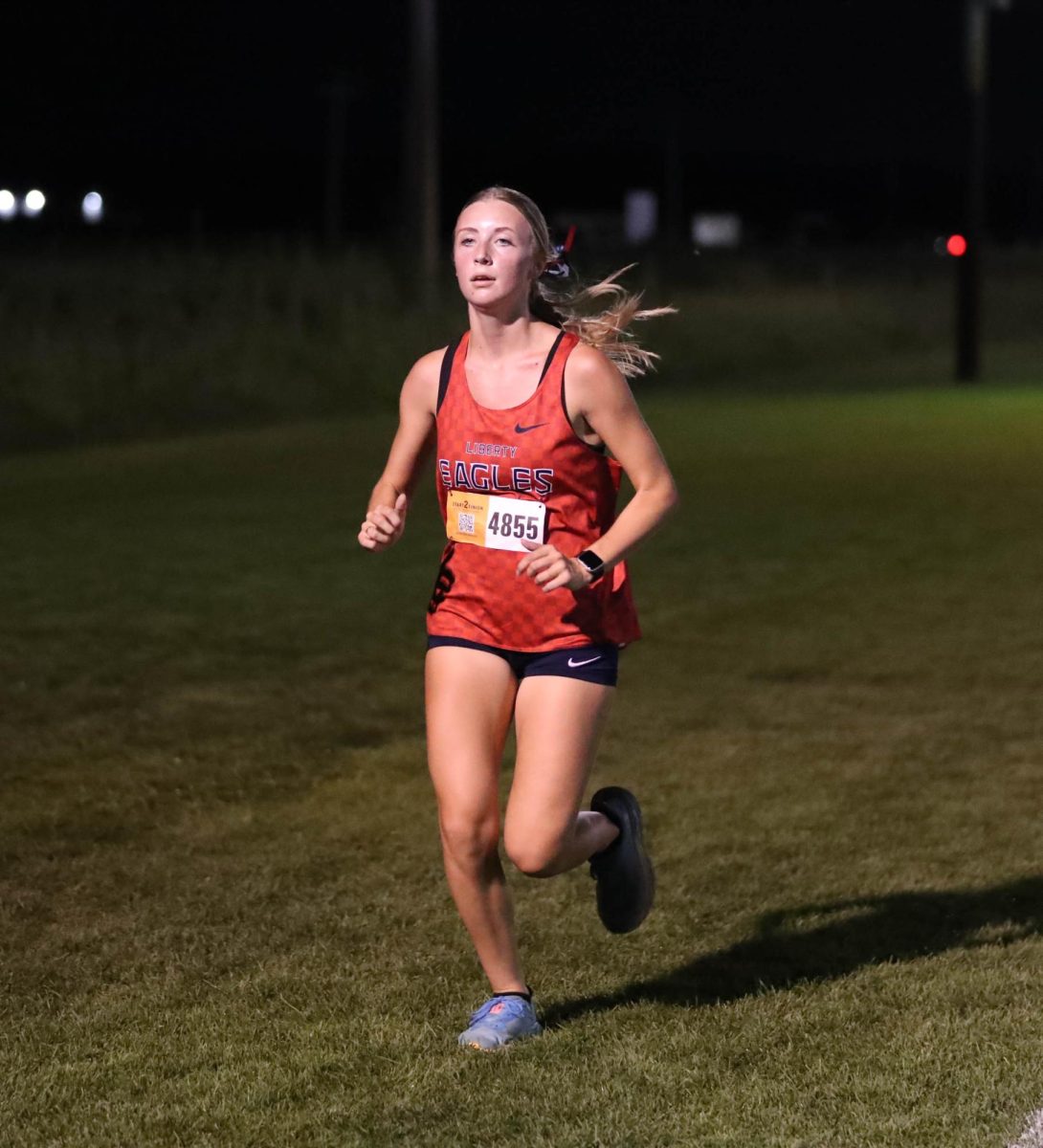 Jillian Kalbac (12) runs to the finish at Twilight meet against Fort Zumwalt North.