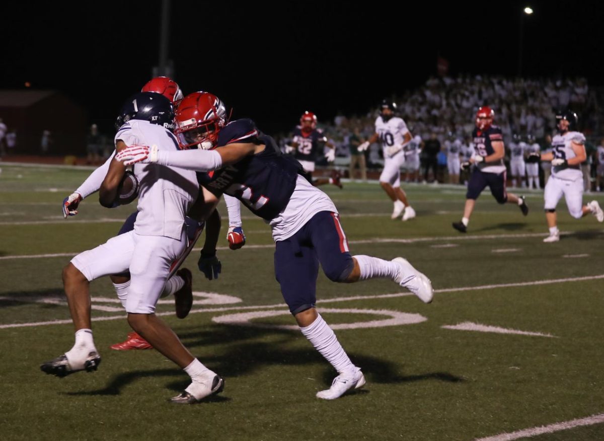 Carson Struttmann (11) tackles a Timberland ball carrier near the 20-yard line. 