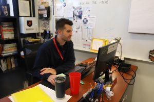 Mr. Alex Schaper works peacefully at his computer as his class does their work. 