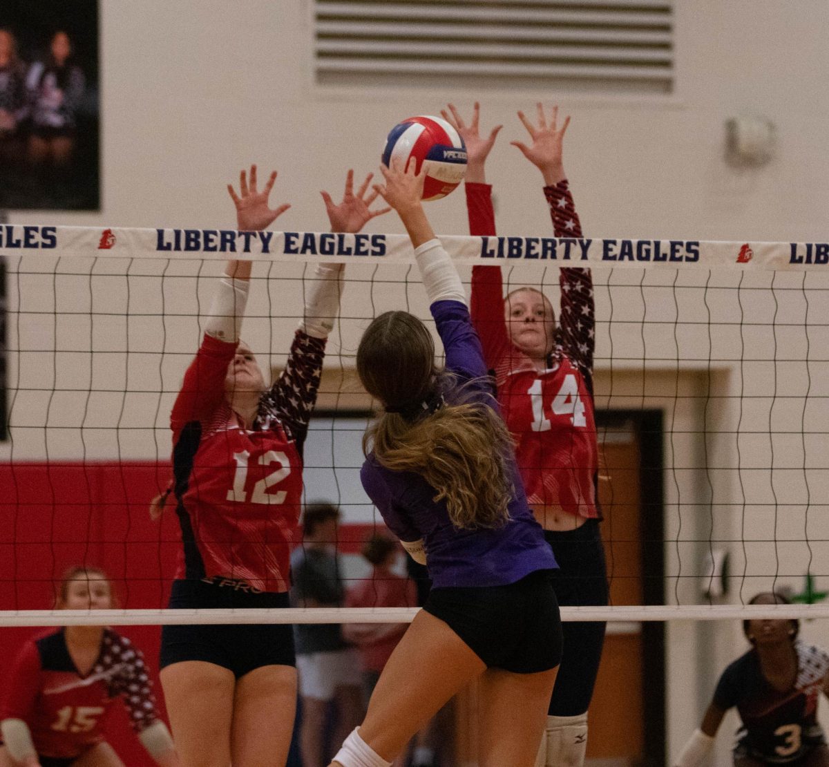 Katelyn Means (10) and Ashlyn Genta (9) attempt block Fort Zumwalt West's hitter.