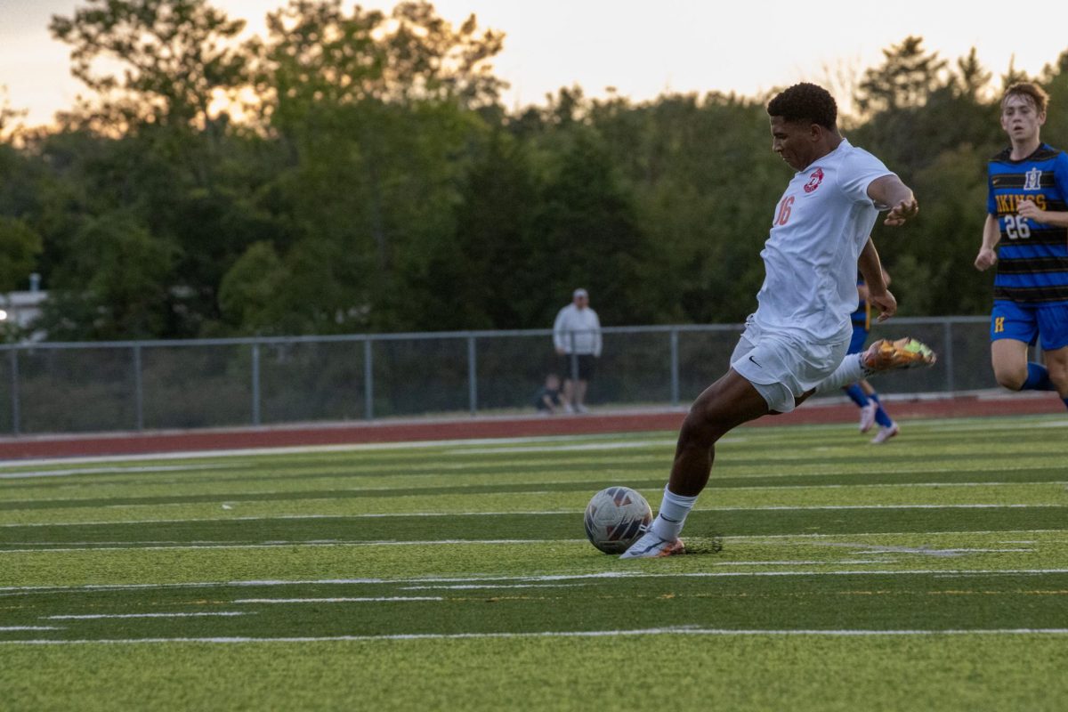 Corey Lynch (11) winds up to hit a free kick into the goal box in a match against Francis Howell on Sept. 3. 