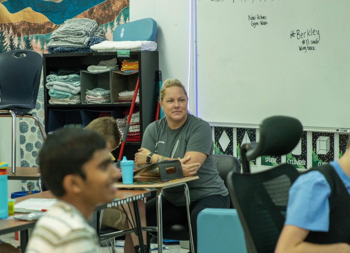 New staff member Laura Lello watching a video with her students during class on 9.12.24