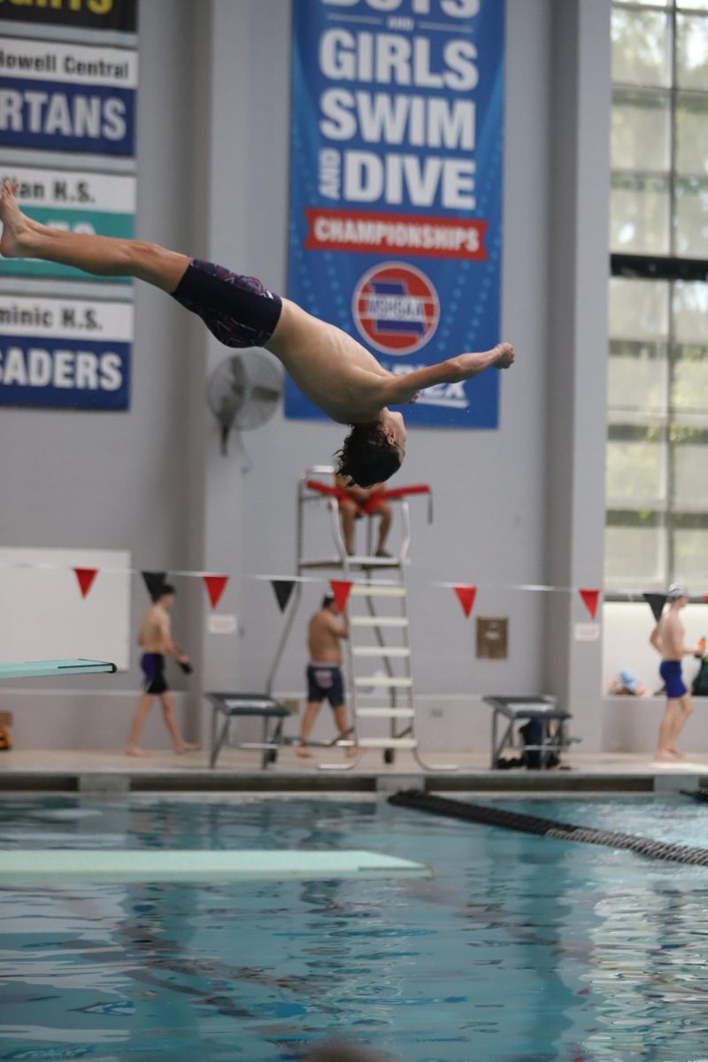 Elijah Quest (10) dives at swim meet against East and Timberland.