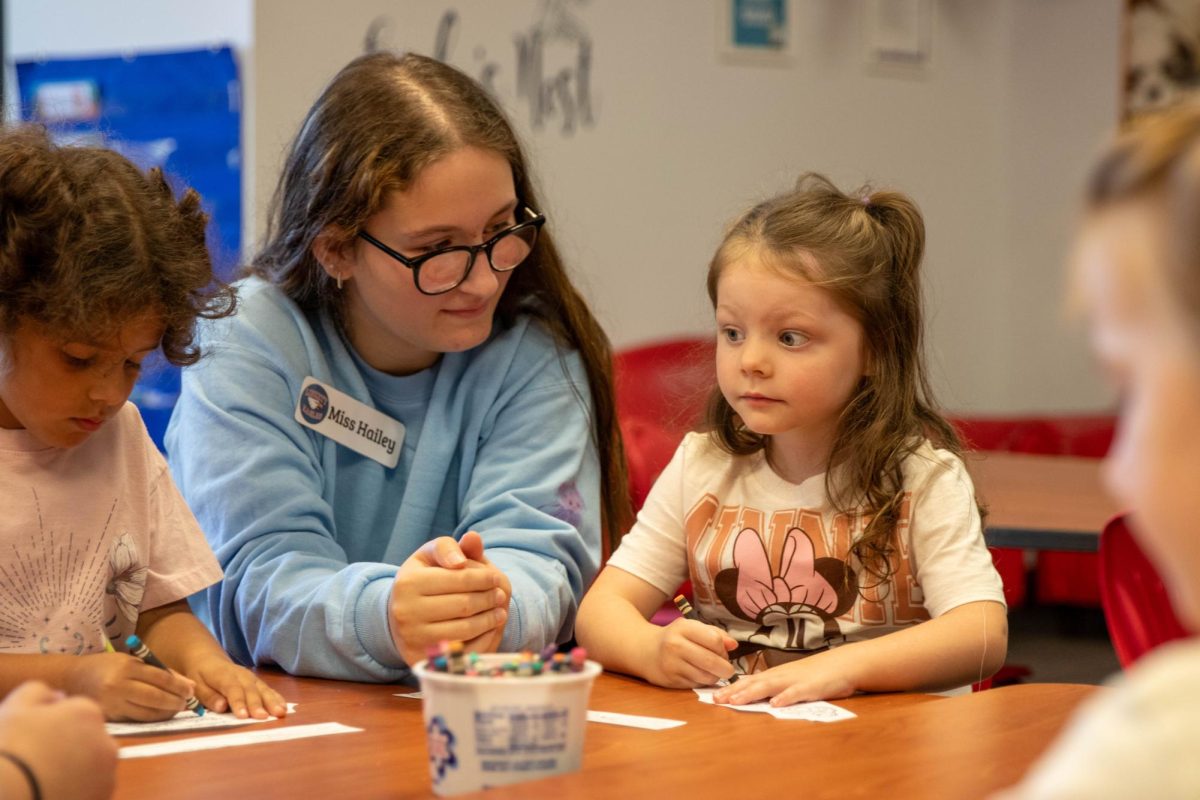 Hailey Pallardy (11) works with a preschooler during a visit on Friday, Sept. 20.