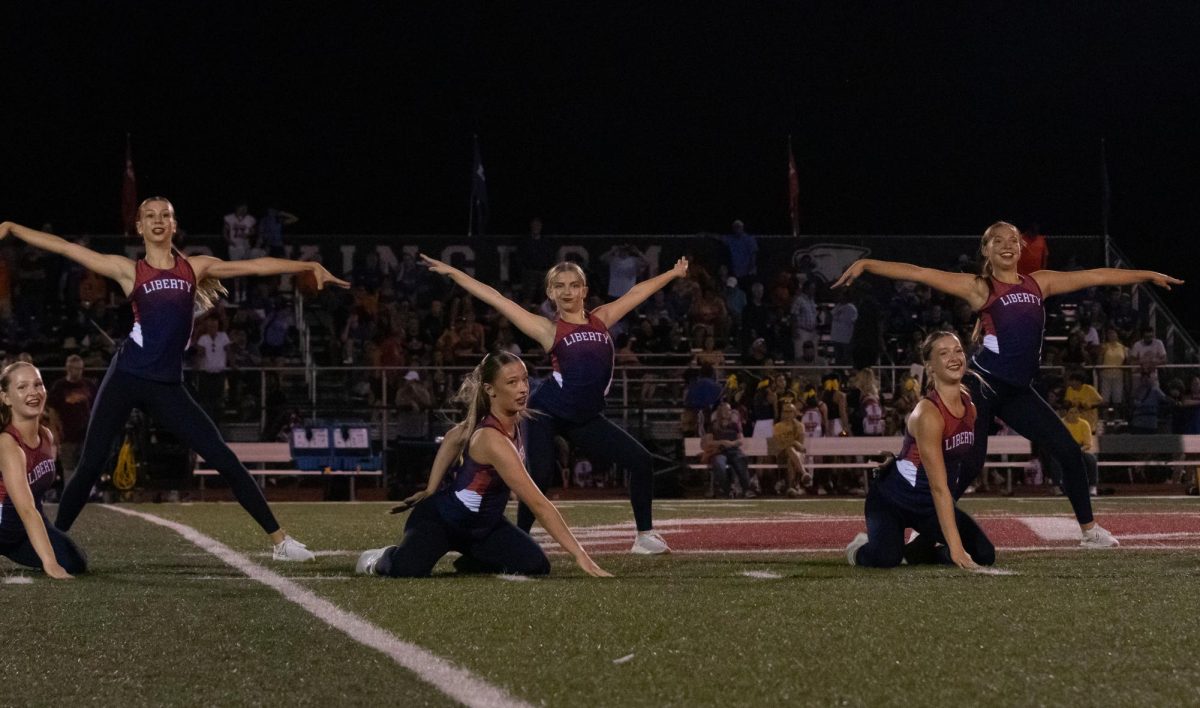 The dance team performs choreography during half time at varsity football game against North Point.