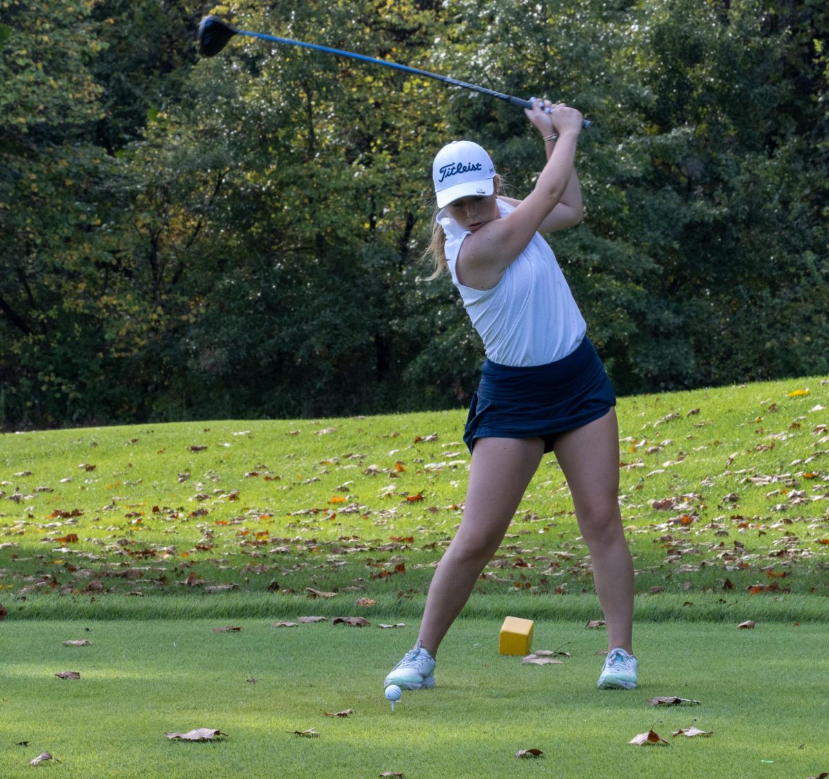 Morgan Buckley (9) tees off in the final regular season match for the girls golf team. 