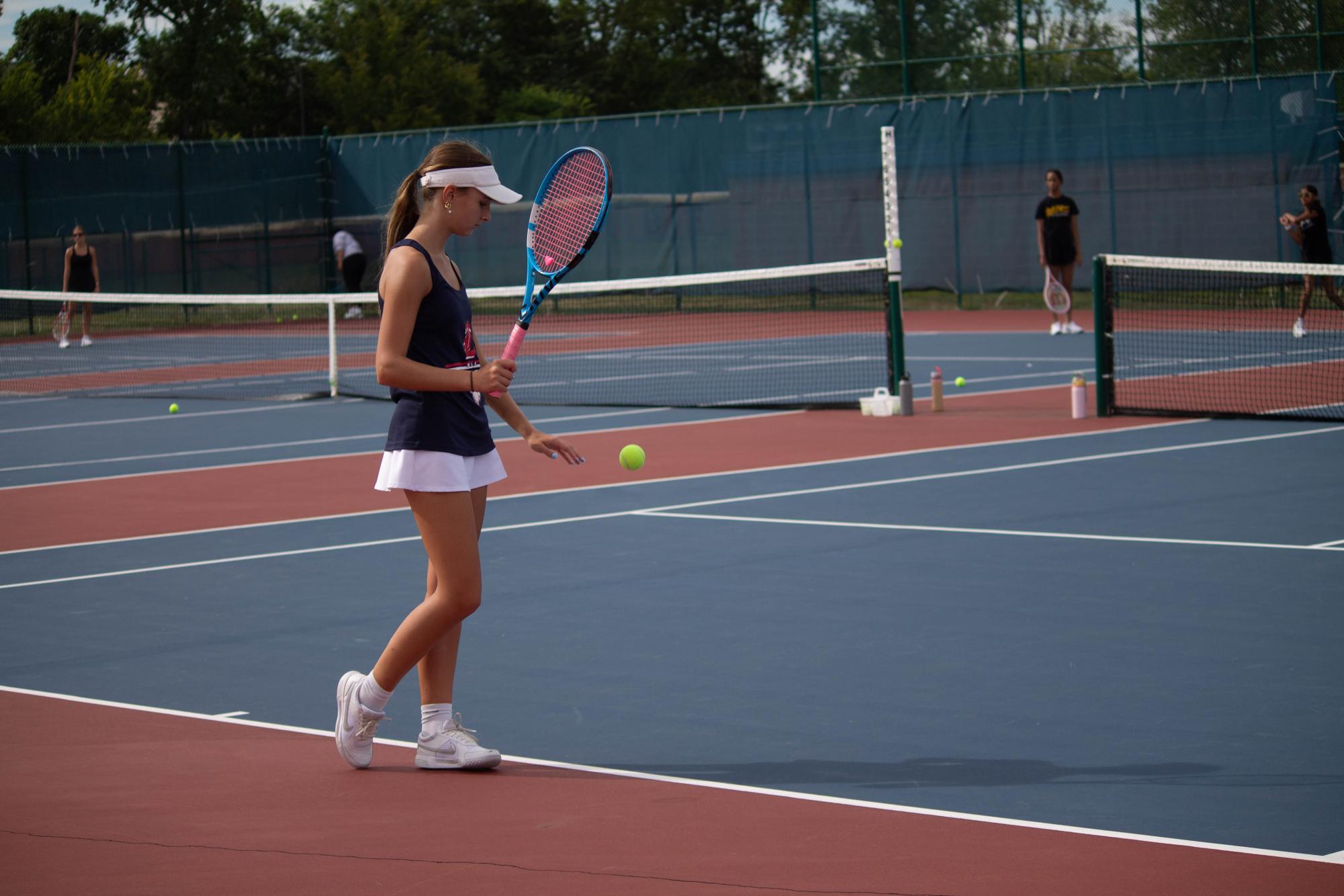 Kaleigh Reitzner and Lyla Sartors prepare for their match against Francis Howell North. 