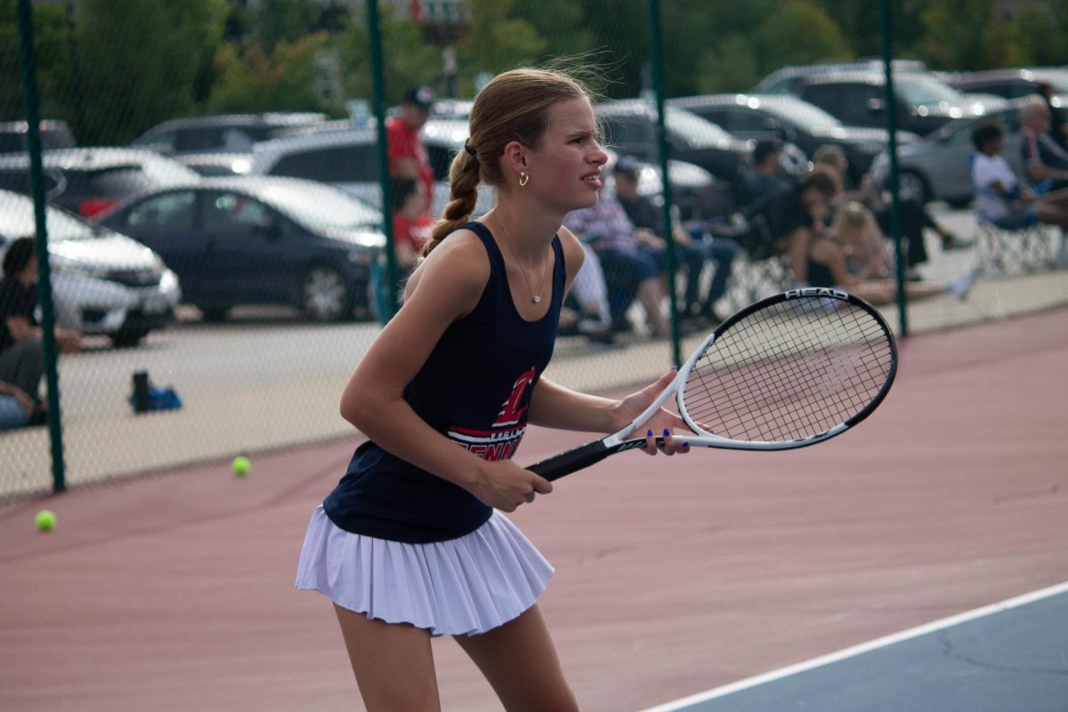 Izzy Moss (9) gets ready to receive a serve against Francis Howell North.