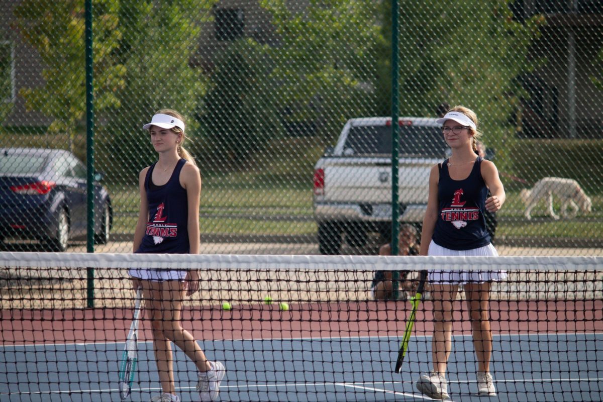 Kaleigh Reitzner and Lyla Sartors prepare for their match against Francis Howell North. 