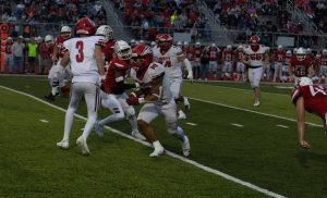 Jaylen Mack (11) finds a hole to run for positive yardage. Mack scored three touchdowns in the game. 