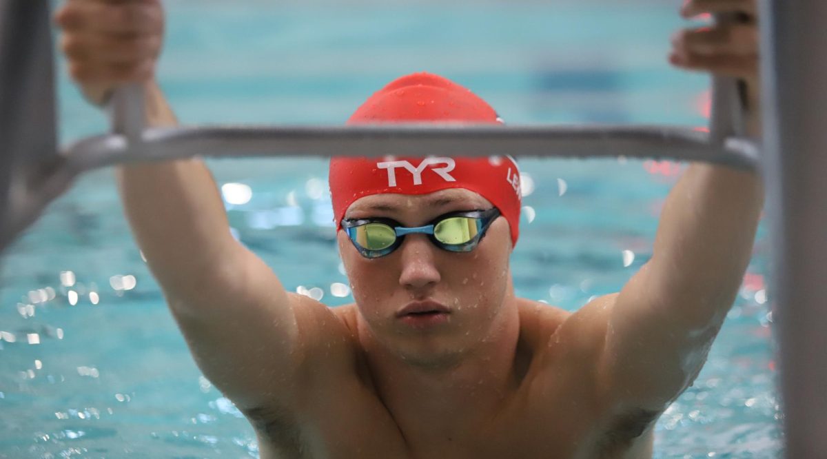 Riley Lewis (11) prepares to start a 50 yard back in the 200 yard medley relay at a boys swim meet against Timberland and Fort Zumwalt East.