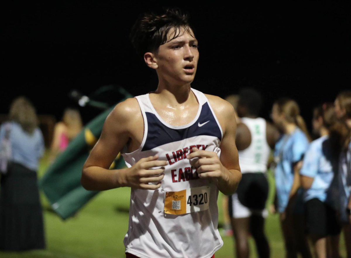 Cross country runner Jasper Leech (11) competes in the FZN Twilight Meet this season. 