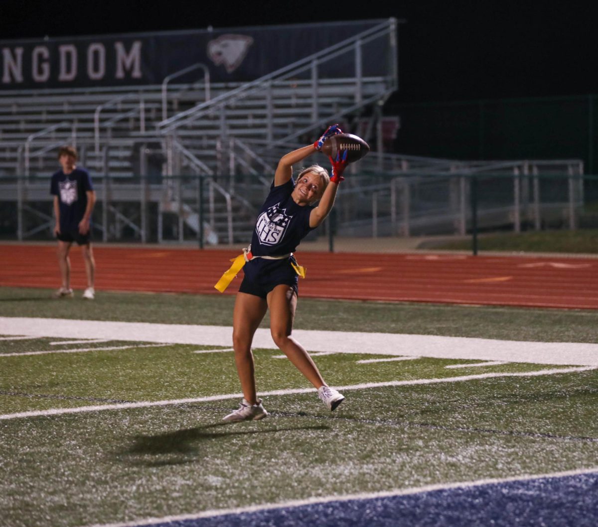 Kylie Graham (11) catches the ball resulting in a touchdown for the junior team during the annual powderpuff game on Oct. 2.