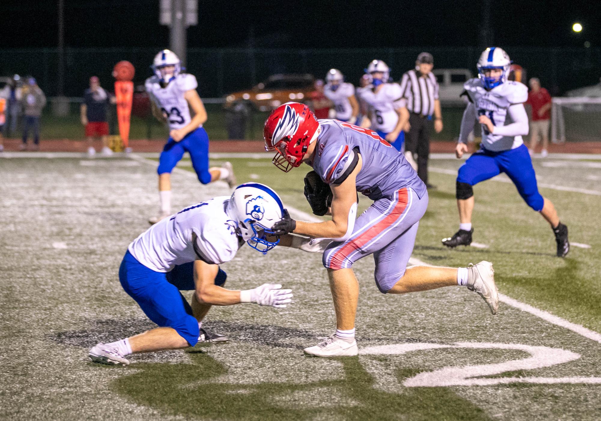 Jonah Kaler (10) runs with the ball at Washington player during homecoming game on Fri. Oct. 4.