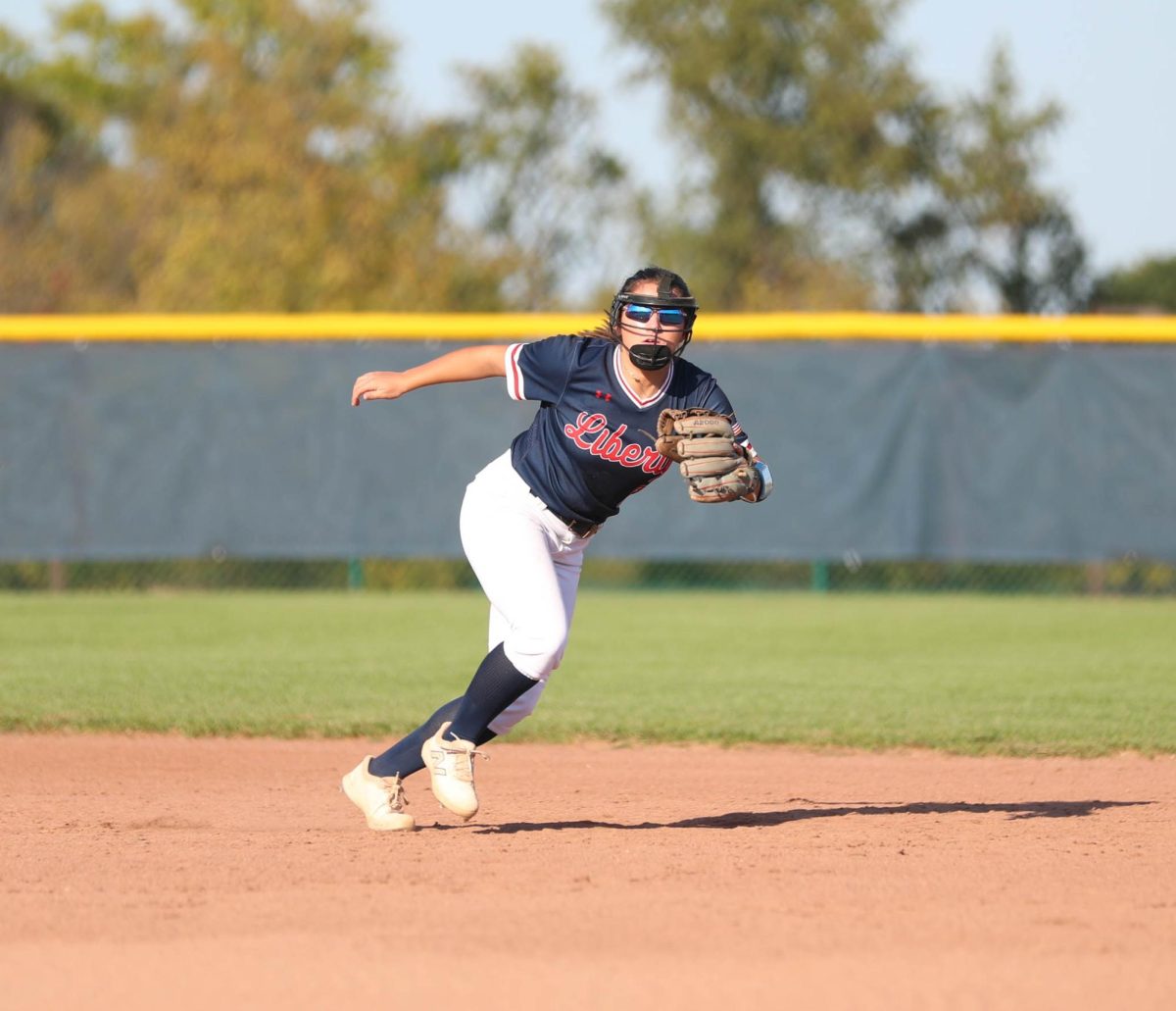 Emily Griffith (10) side steps as Parkway South player hits the ball toward outfield.