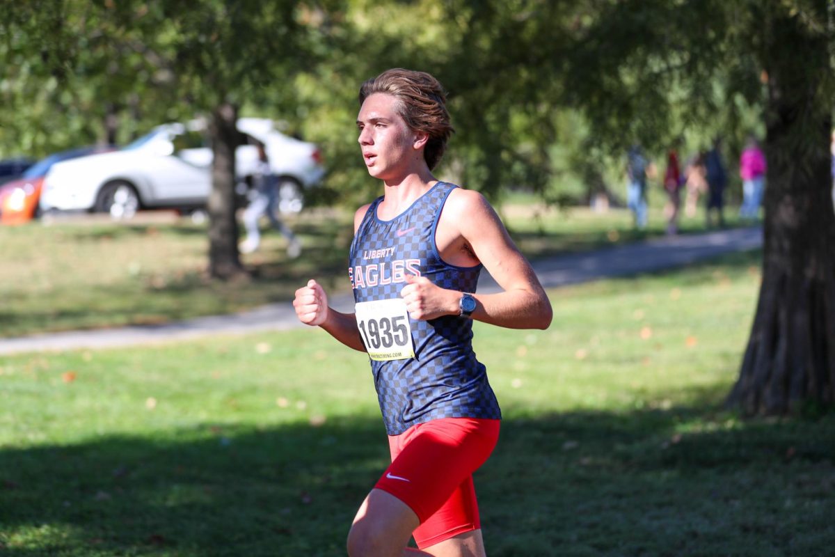 Ayden Taylor (12) runs his last lap toward the finish line at the GAC Conference meet. 