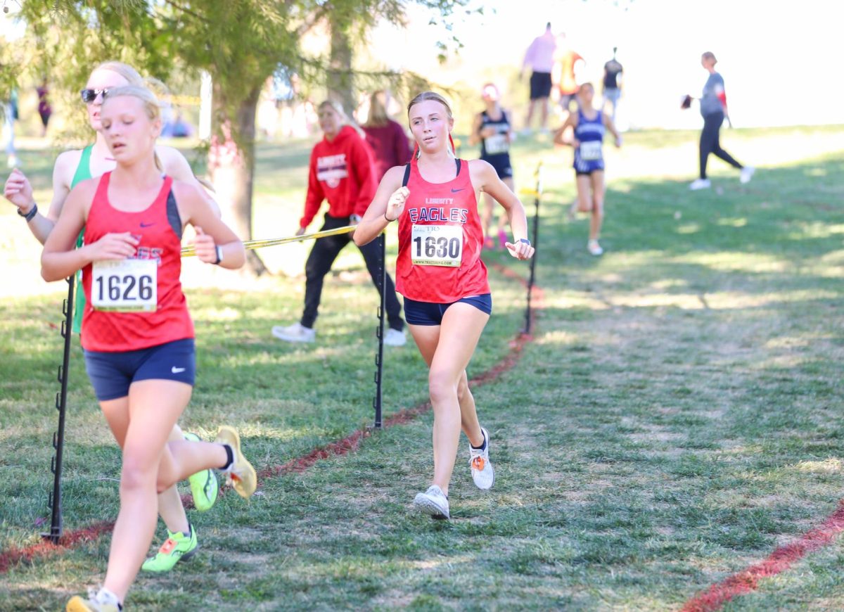 Jillian Kalbac (12) breathes while running her race at the GAC Conference meet.