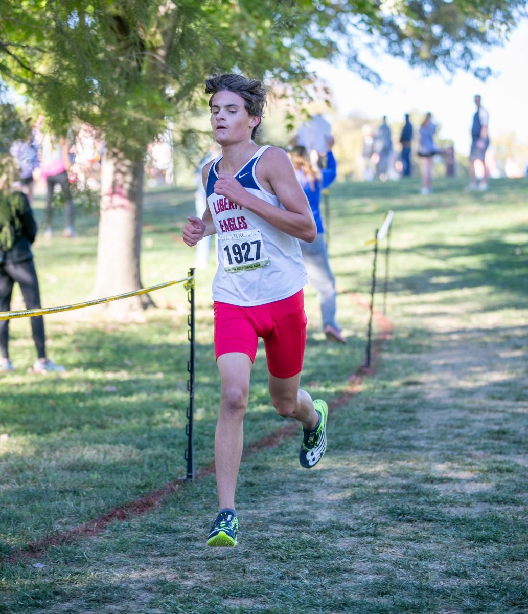 Daniel Olson (11) picks up his pace on his last lap of his GAC Conference race.