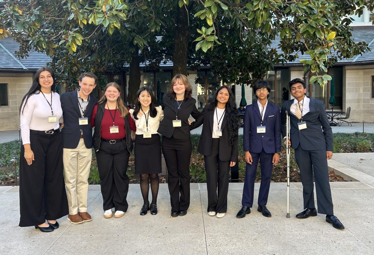 The Model UN team stands outside of their conference at Washington University. 