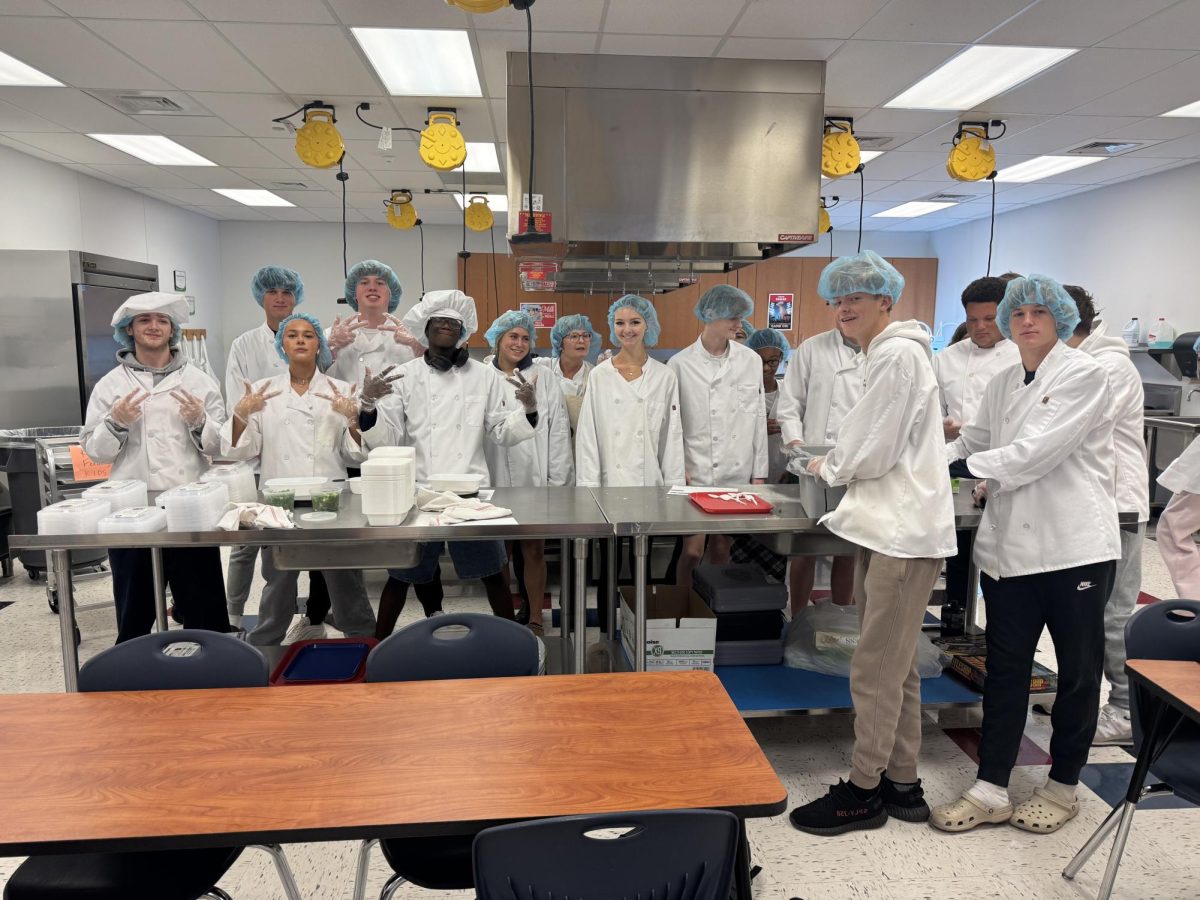 Culinary classes II and III prepare chicken stir fry for approximately 80 families in need. 