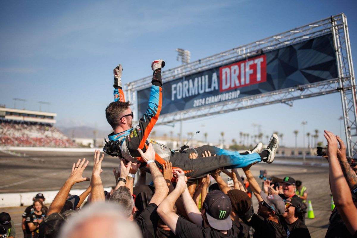 James Deane's RTR team throws him in the air in celebration (Provided with permission by Formula Drift)