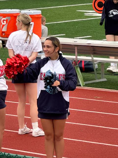 Layla Childers is on the sideline cheering for her school's football team.