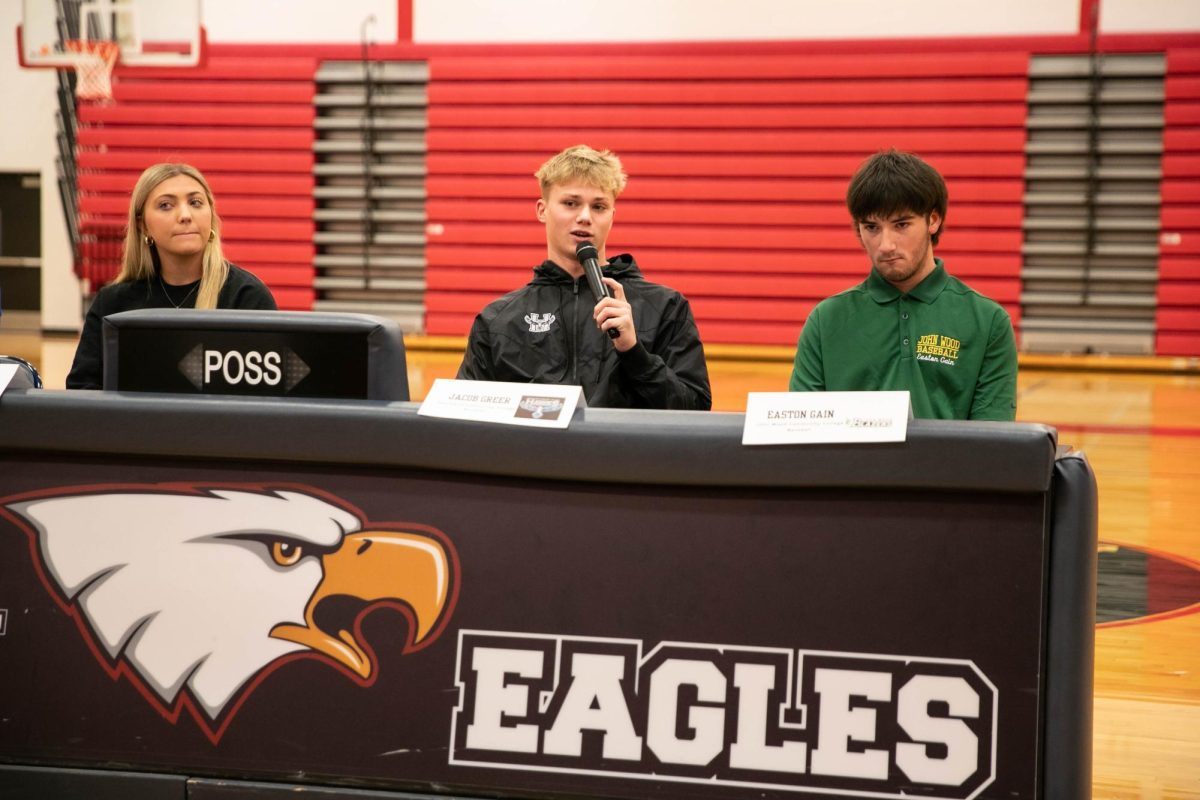 Jacob Greer answers a question at the table during National Signing Day.