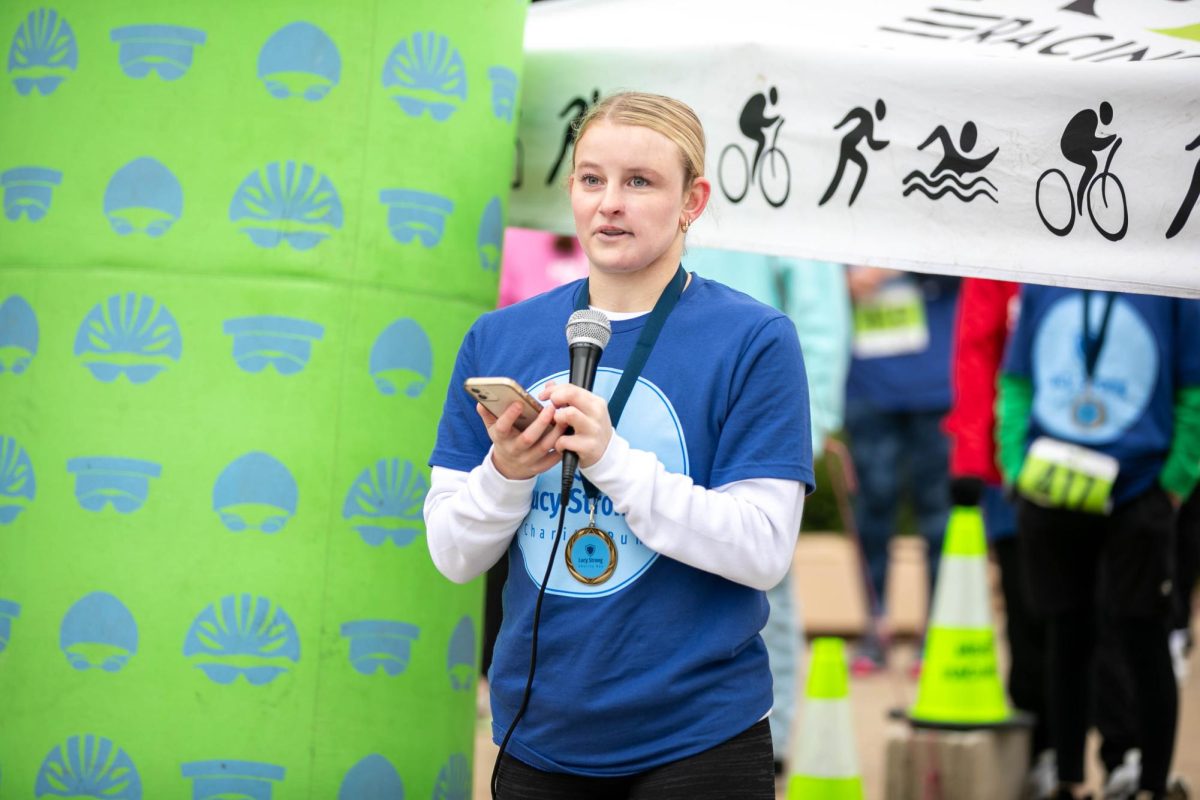 Lucy Lant (10) gives a speech to the crowd after the 5k race.