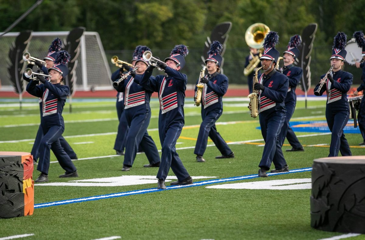 Marching Band performs at a football game earlier in the season.