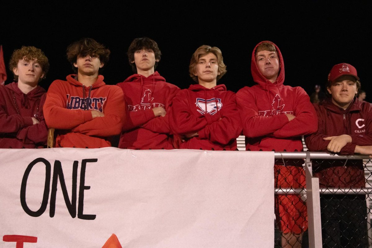 During the first round district football game, students show up in spirit while standing at the front of the student section with no one behind them.