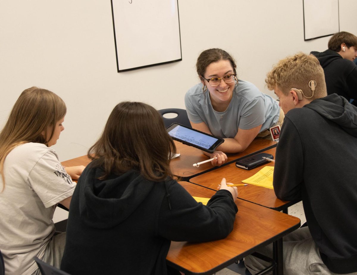 Mrs. Lockwood joyfully engages with her students as they begin their new unit.