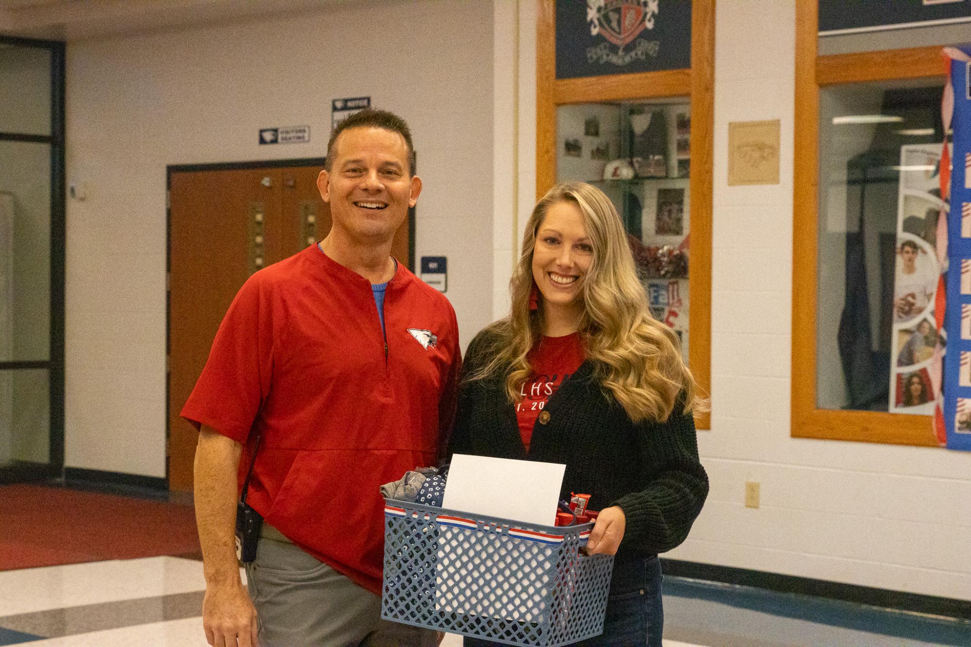 Principal Edgar Nelson poses for a photo with teacher of the year, Lindsey Holmes.