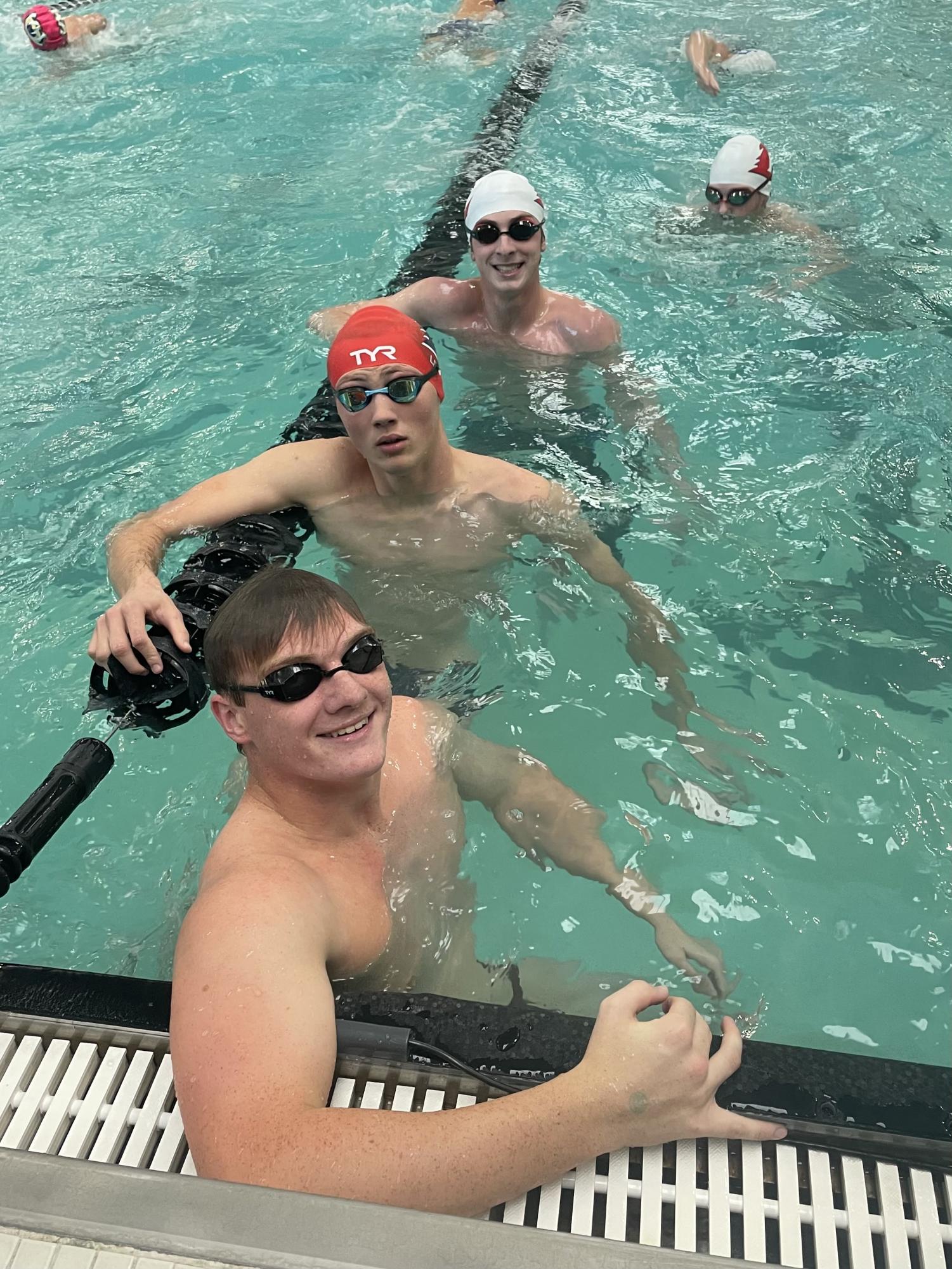 Ryan Lipski, Riley Lewis, Henry Carlson, and Garret Allen in the pool warming up before state 