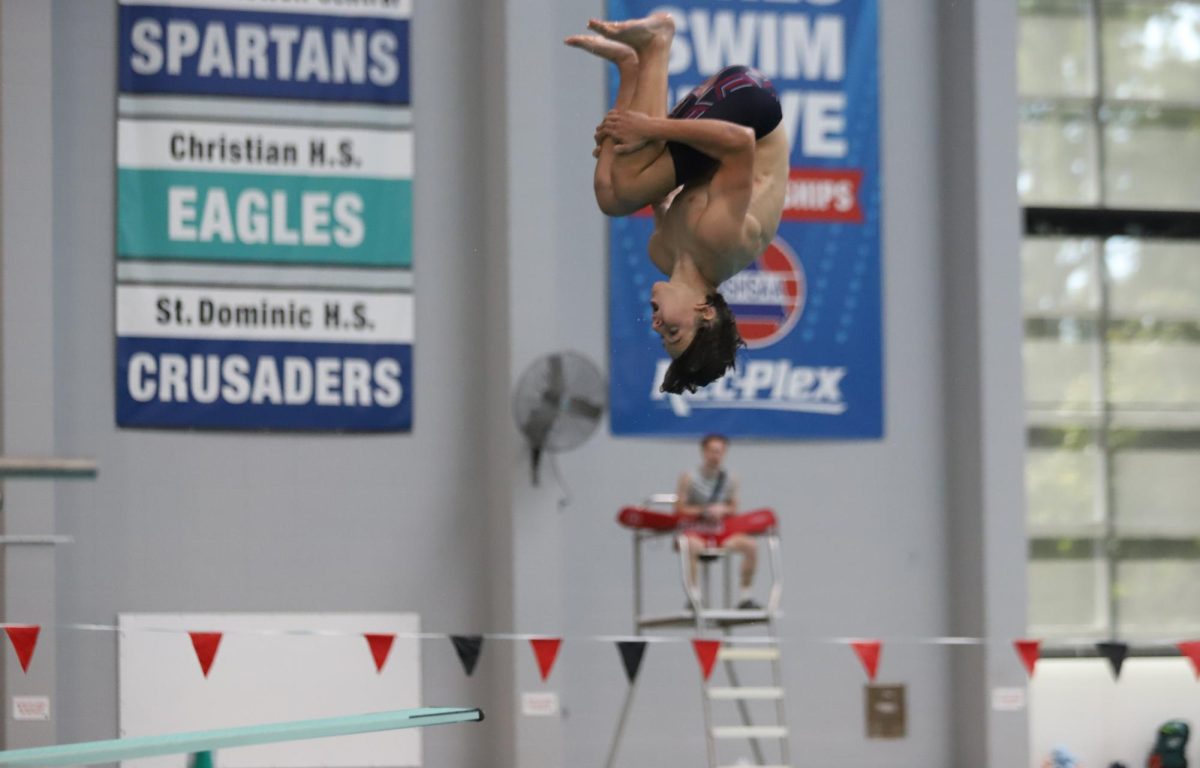 Elijah Quest tucks into his dive on Sept. 18 in a meet against Zumwalt East and Timberland. 