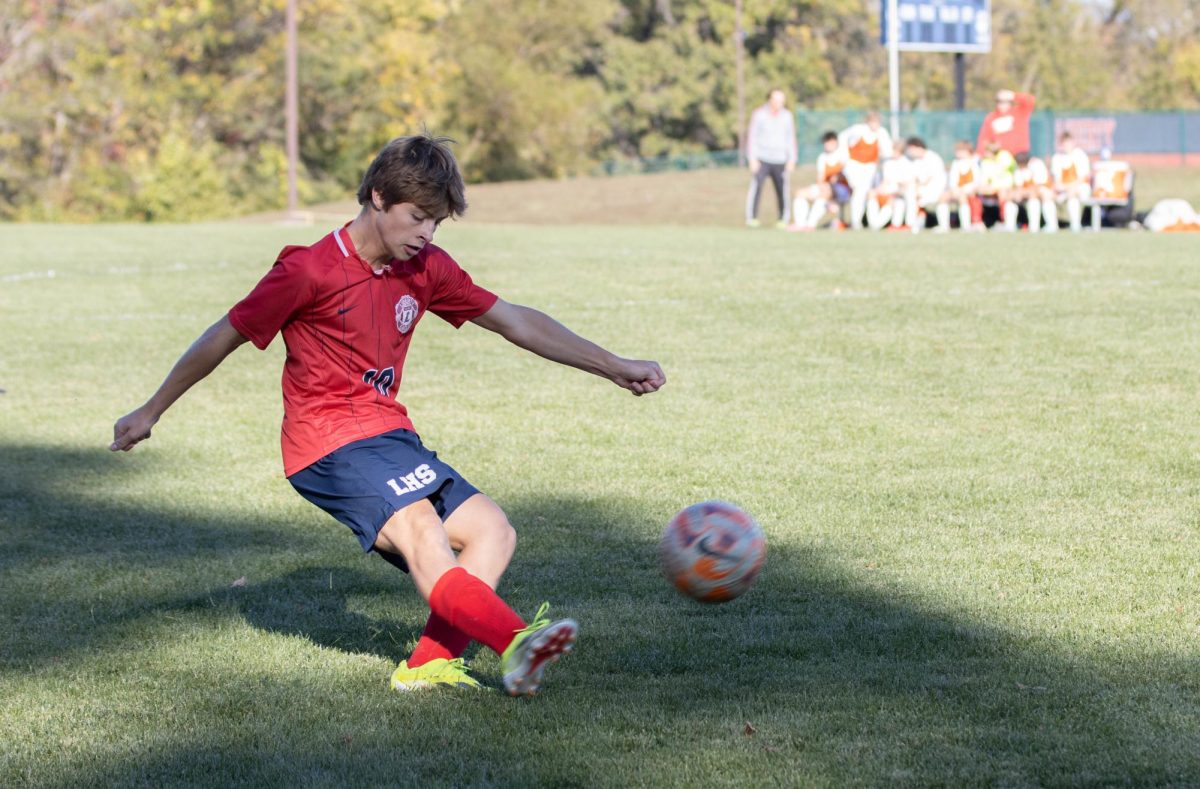 Nicholas Kuhn (10) kicks the ball towards the goal in a game against Chaminade on Oct. 16. 