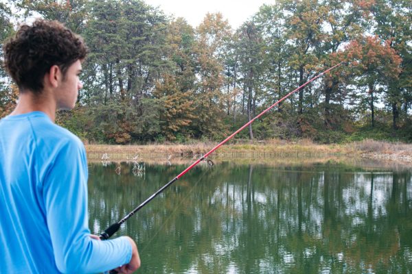 Brayden Davies (11) waits for a fish to bite his hook.