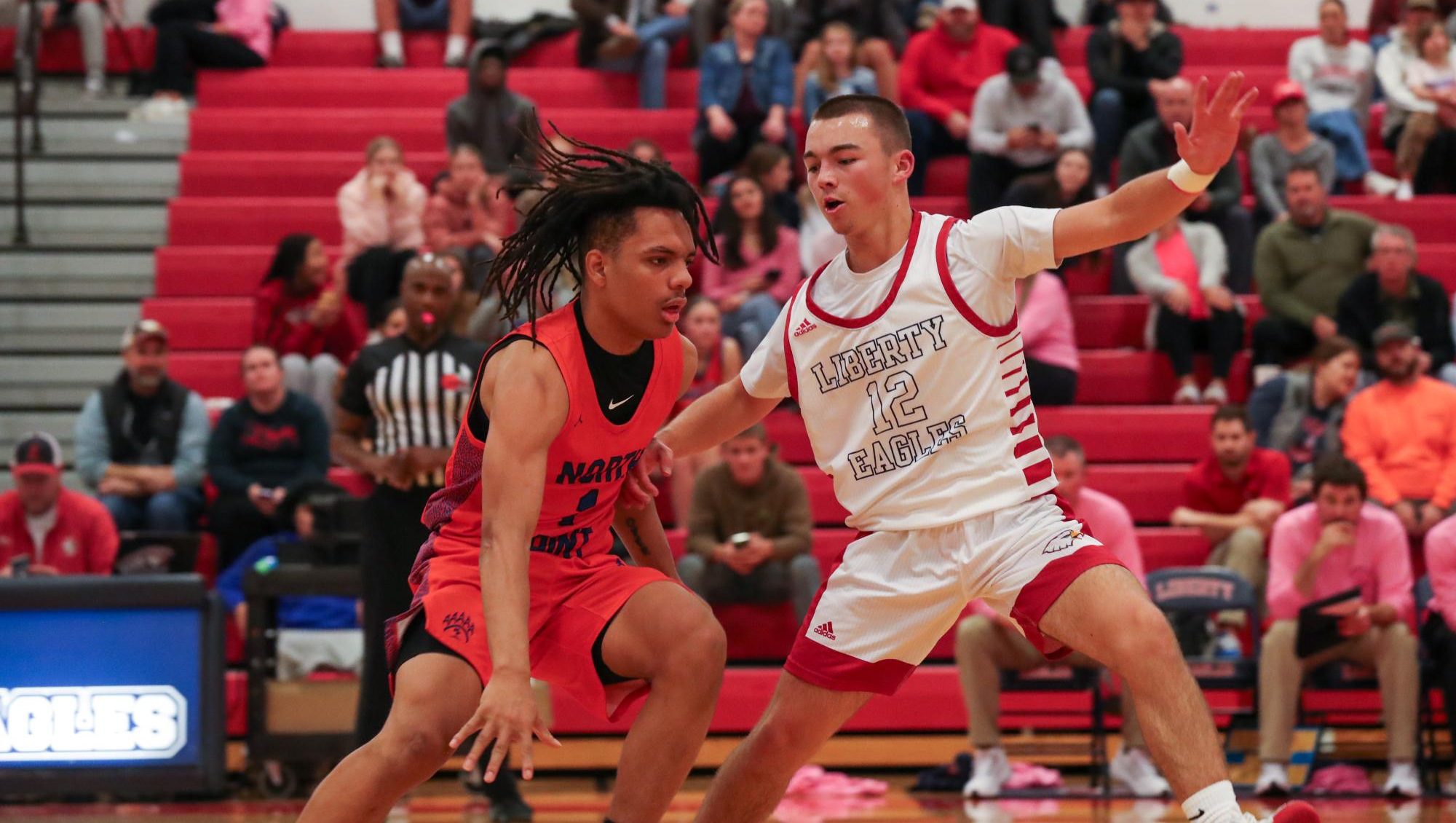 Tyler Cook (11) attempts to block a North Point player from reaching the basket at the Coaches vs. Cancer game.