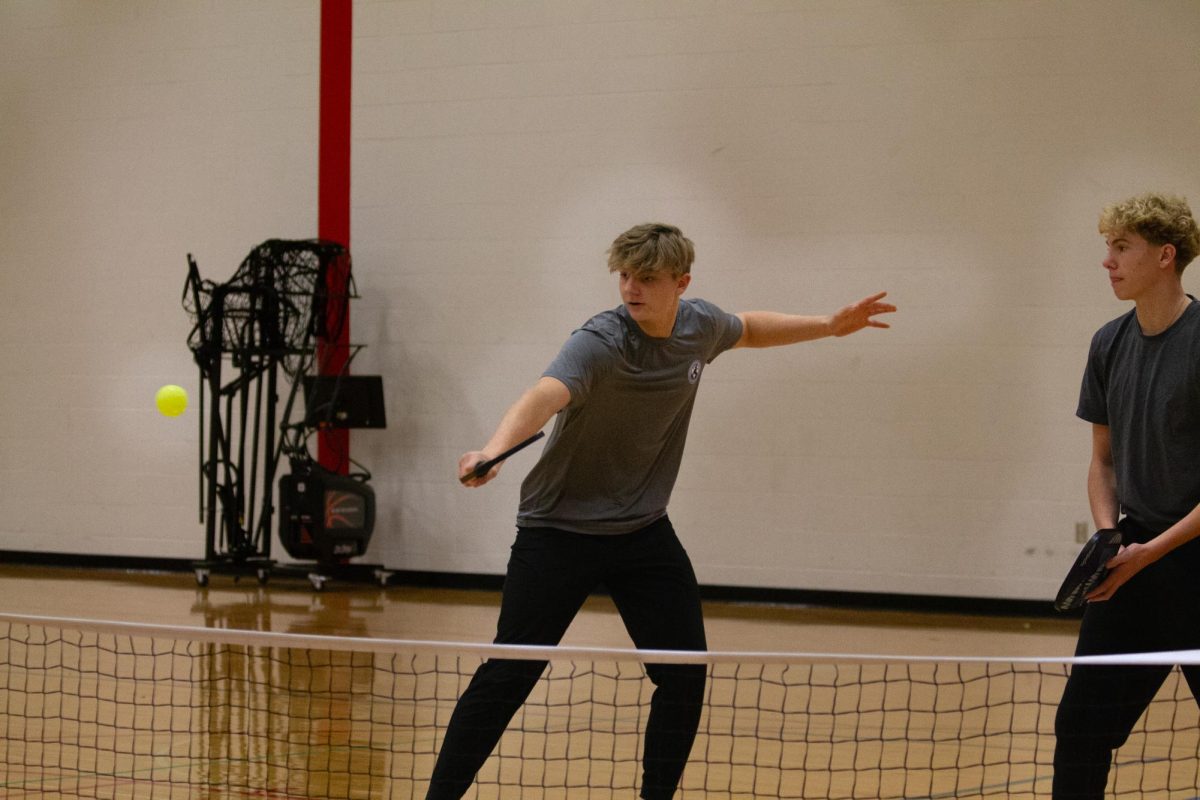 Davis Mueth (11) and Tyler Meier (11) play pickleball together.