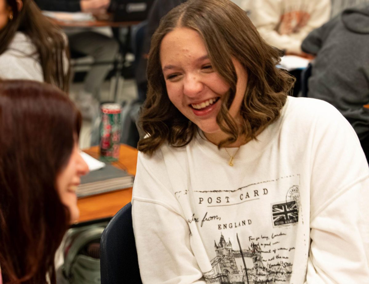 Lydia Davis (10) laughs with friends in Mrs. Bryan's advanced English II class.