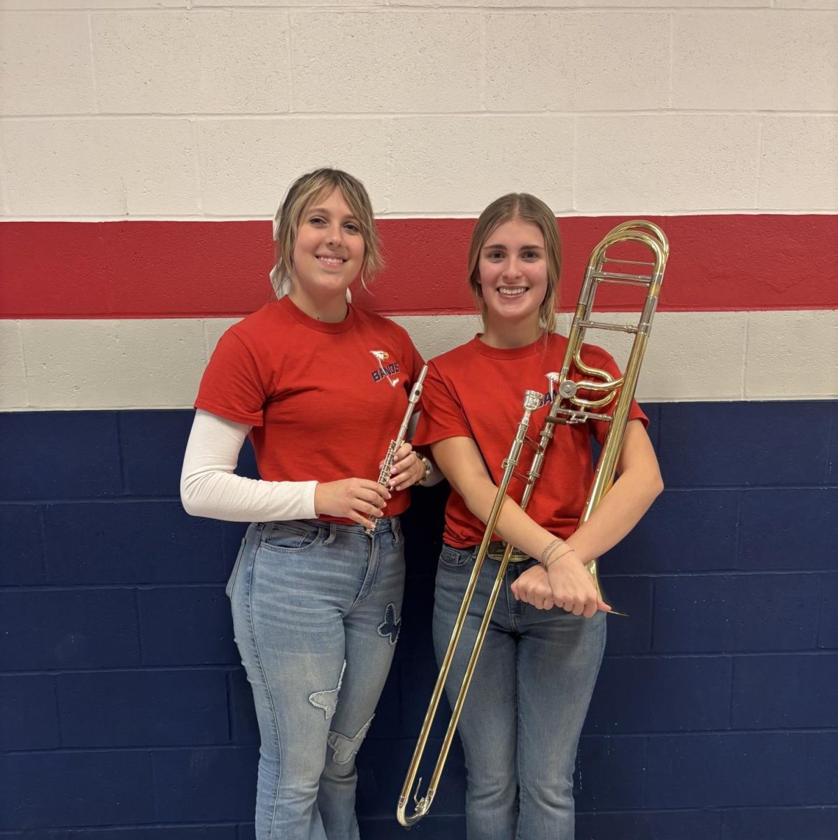 Macy's Thanksgiving Day performers, Izzi and Matteson stand together with their instrument in hand.